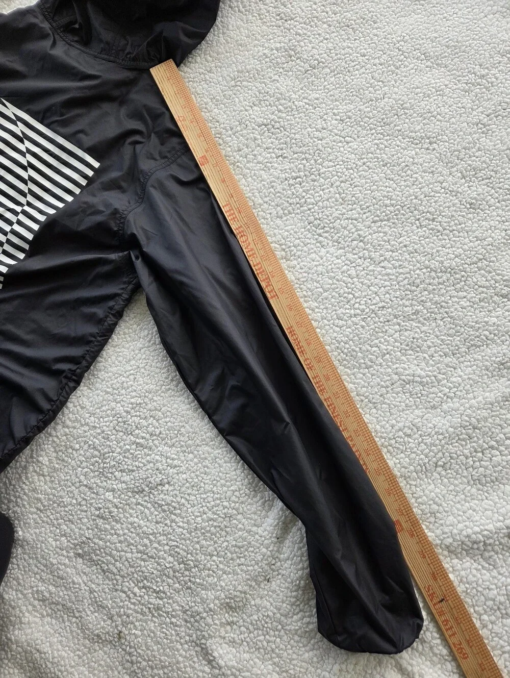 The North Face Optical Cyclone windbreaker features a distinctive optical illusi